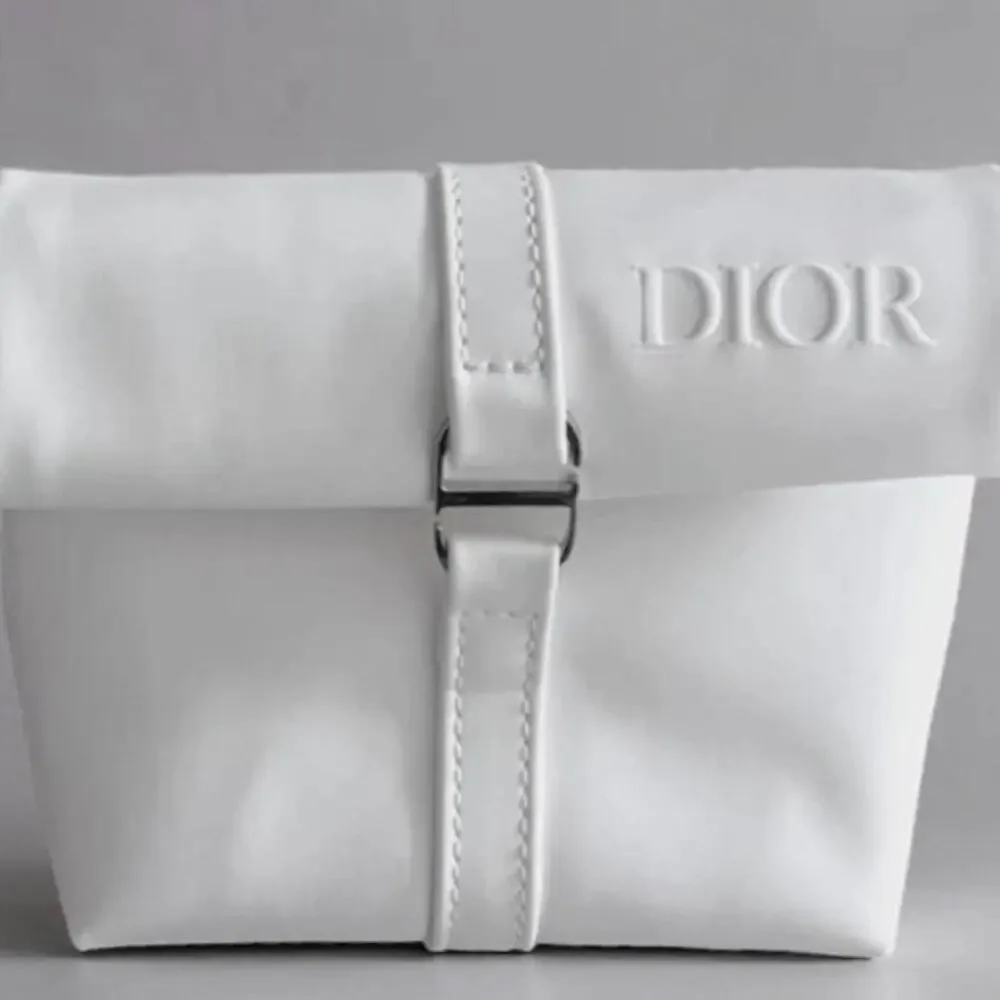 Dior white roll top cosmetic pouch